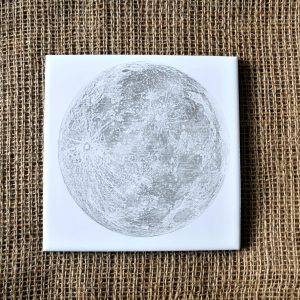 Moon laser etched on a white ceramic tile